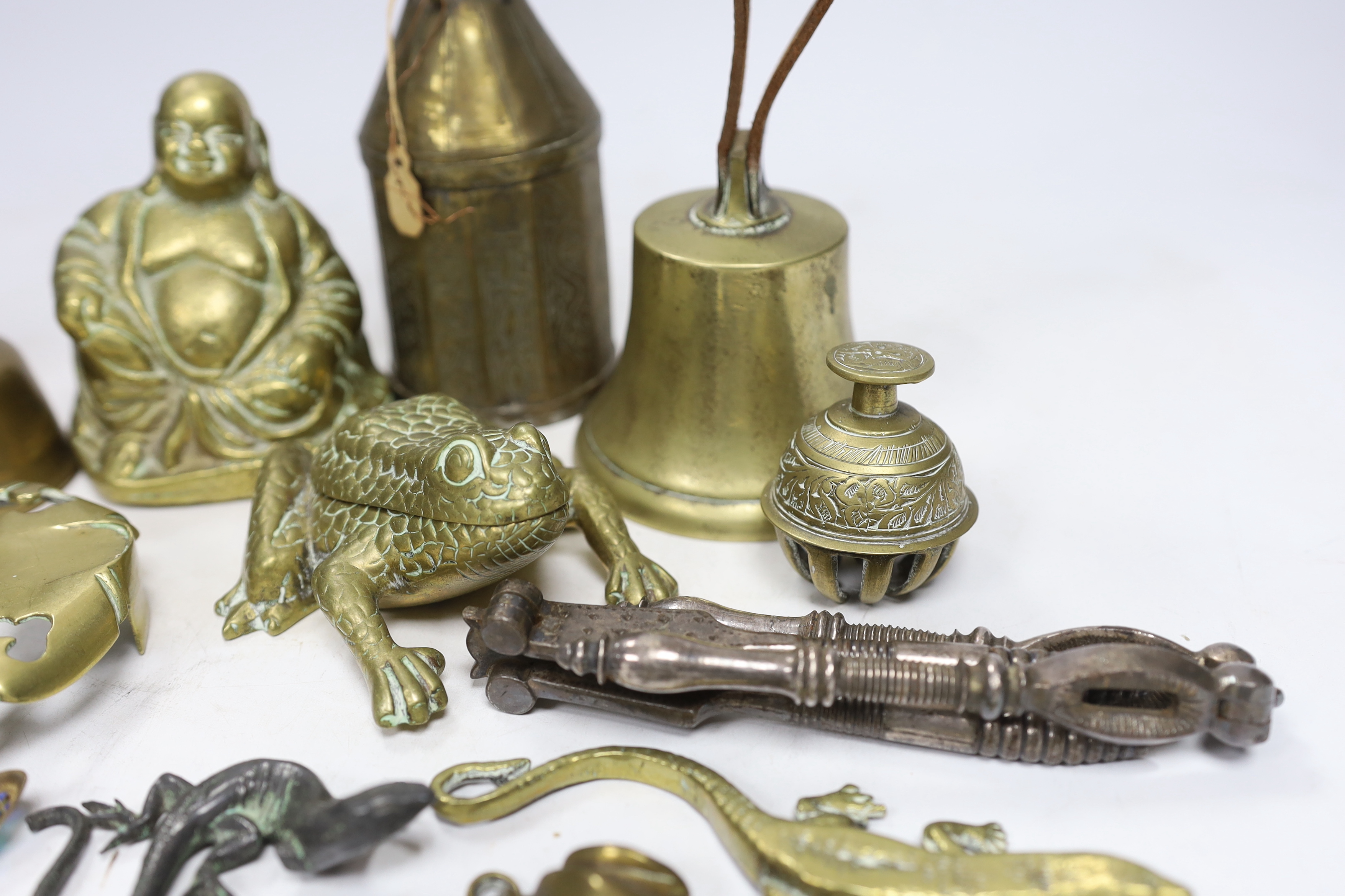 Sundry metalware including hinged brass frog with compartment, nutcrackers, a seated Buddha and a 925 gilt enamel spoon